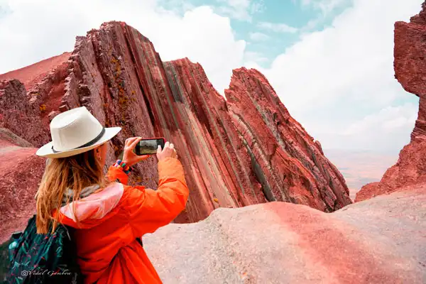 Taking photo to Pallay Punchu Rainbow Mountain